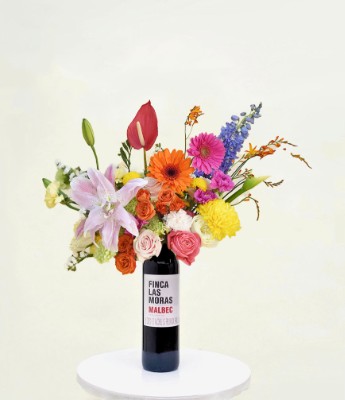 Contrata el servicio de Bouquet Base Botella de Vino Color Ocaso en Partymax. Imagen #1